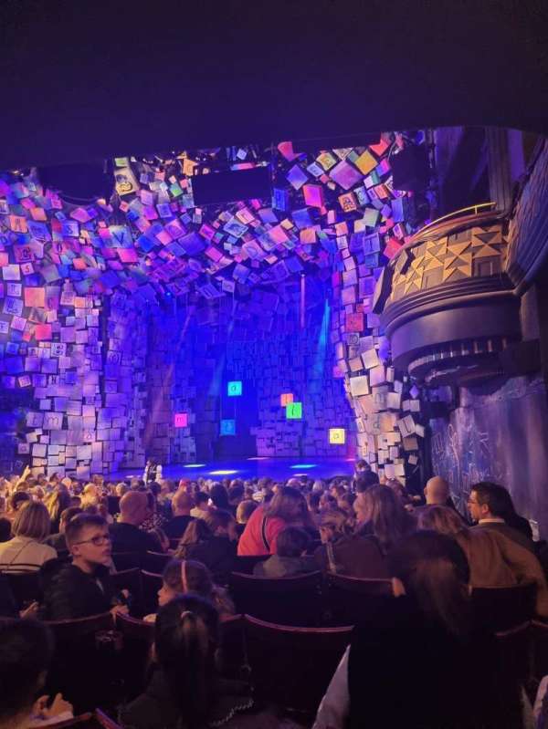 Cambridge Theatre, section: Stalls, row: R, seat: 1